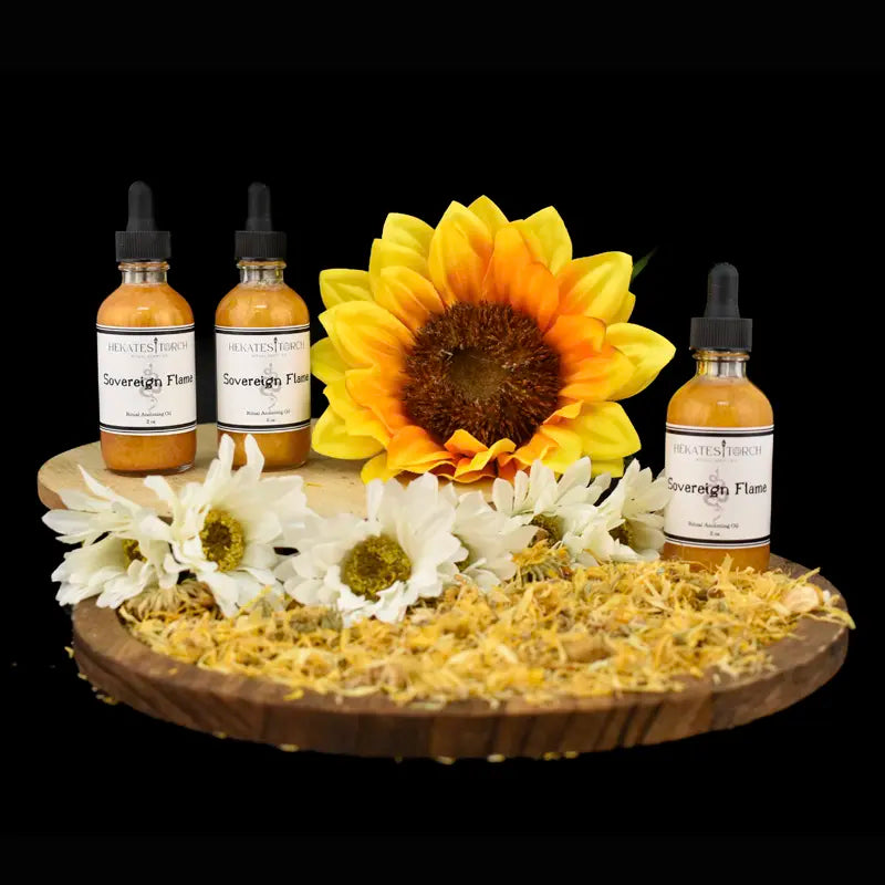 Sovereign Flame Oil bottles with sunflowers on wooden display